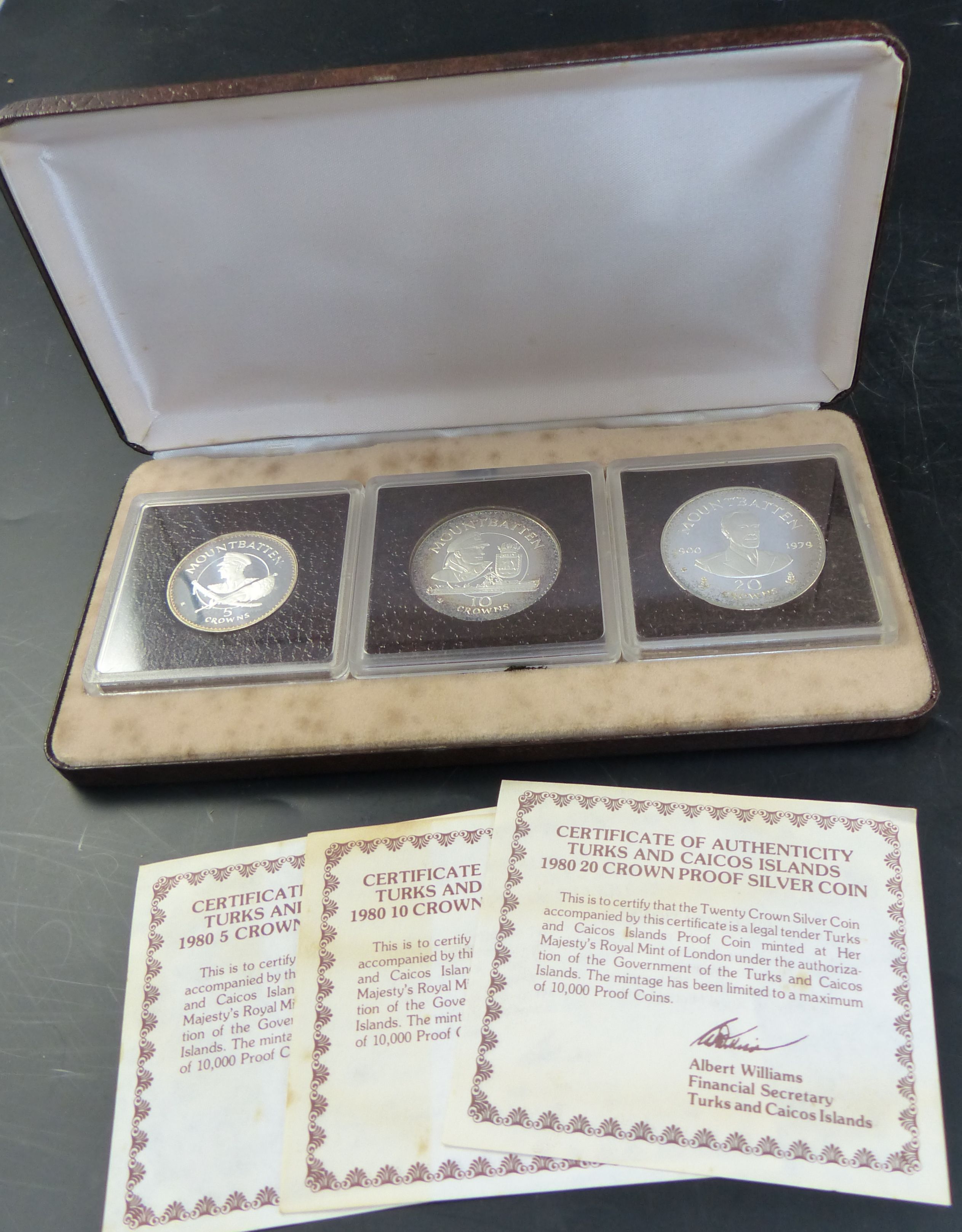 Three Turks and Caicos Islands proof coin sets, 1980 set of four 100 crown proof gold coin with 2010 and five crowns in silver;